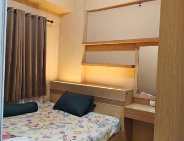 Green pramuka by Santoso Family in Jakarta