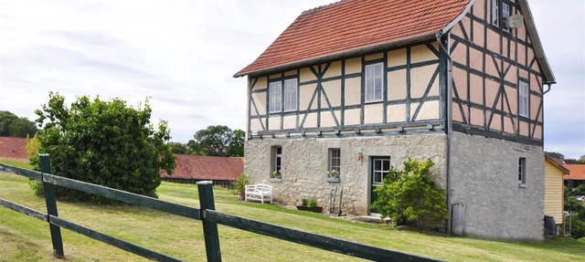 half-timbered house from the 18 century, with view on the Wartburg in Hessen