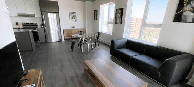 Spacious 2BR with Skyline Views, Near Place Vertu in Montréal