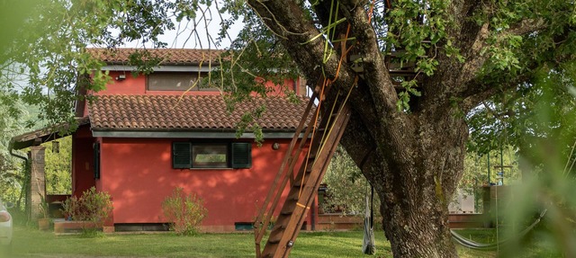 The Red House in the Green Oasis in Canale monterano